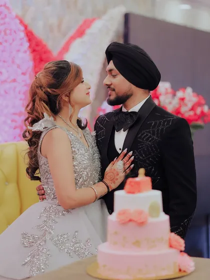 A sweet moment by the engagement cake. I focus on capturing the chemistry and the loving glances the couple share throughout their special day.