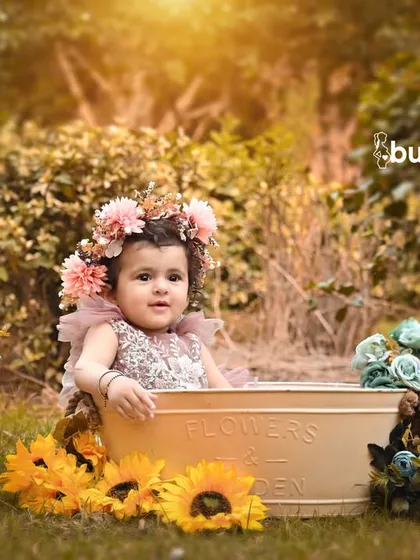 Taking the fun outdoors, this session uses natural sunlight and a beautiful garden setting. A floral-themed tub shoot like this is perfect for capturing your baby's happy personality in a fresh, vibrant environment.