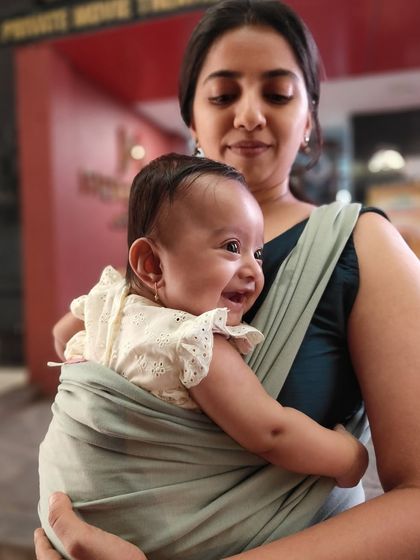 That beautiful newborn smile. Using a baby sling was a wonderful way to keep her close while having my hands free.