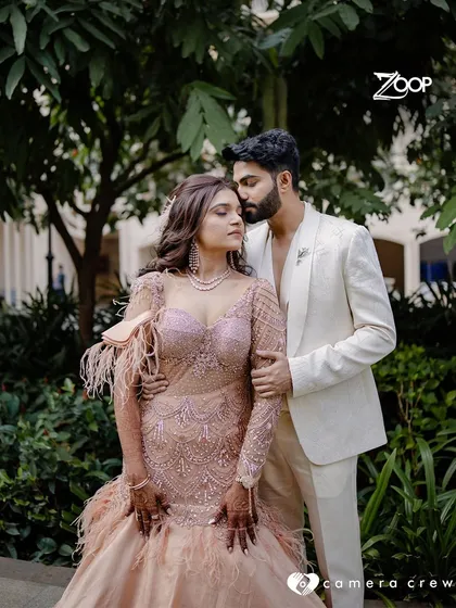 We are privileged to be a part of so many love stories. Here, a groom wears a custom-made, all-white textured tuxedo for his special day. Our goal is to create an outfit that not only fits perfectly but also complements the moment, ensuring you look and feel timeless.