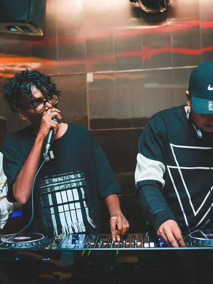 Back to back with another DJ, creating a unique sound for the night. I love collaborating with other artists to bring something fresh to the console.