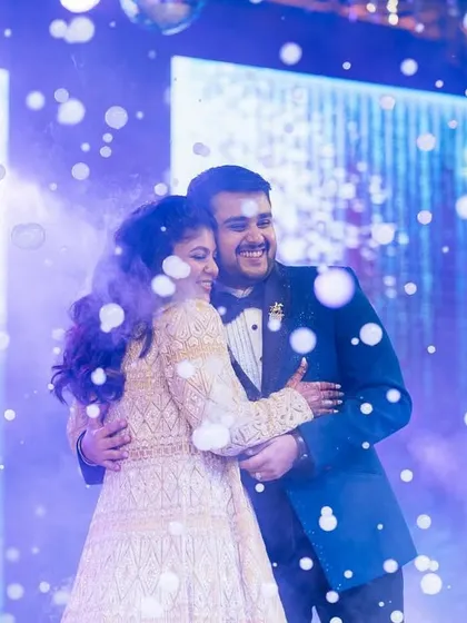 A sweet, happy moment between the couple, surrounded by a bubble-filled dance floor. We use creative effects to add a touch of whimsy.