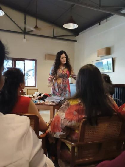 Presenting styling concepts to the Herkey group. I use a variety of scarves, accessories, and clothing items to demonstrate how to build a versatile and impactful wardrobe.