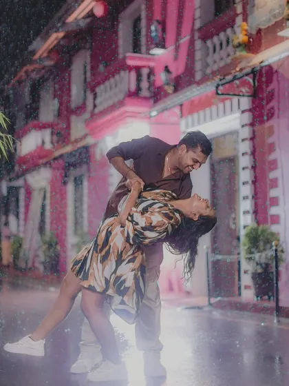 Dancing in a sudden Goa downpour. Instead of stopping, we embraced the moment, capturing this spontaneous, romantic dip in the rain. It shows that the most beautiful stories are often unscripted.