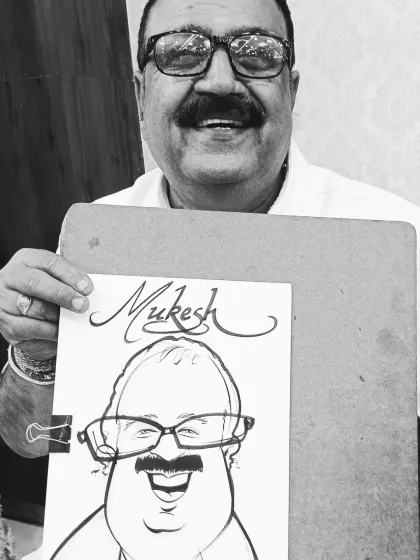 This guest at an engagement ceremony in Itarsi, Madhya Pradesh, was so happy with his caricature. I travel all over India to bring this unique form of entertainment to events.
