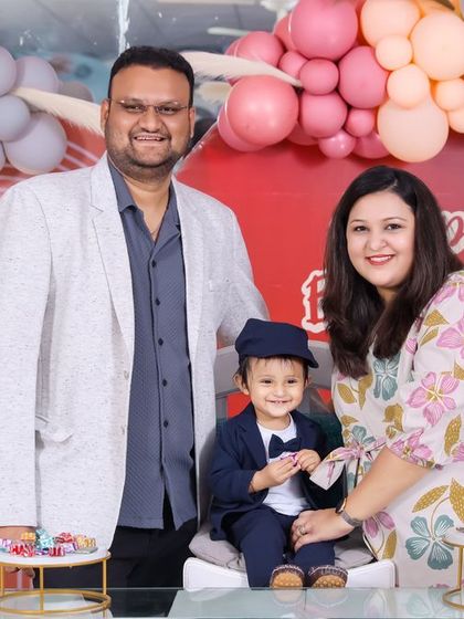 A thrilling 'Dinosaur' themed birthday party, with prehistoric backdrops, dinosaur cutouts, and lush greenery, transporting guests to a Jurassic world.