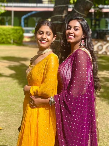 Posing with a friend at a wedding event. I love being part of celebrations and helping make them special through dance.