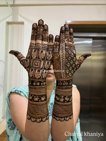 This is for the client who says, "aaj toh paisa vasool karna hai!" A super intricate and heavy traditional design packed with geometric checks, floral bands, and detailed finger work.