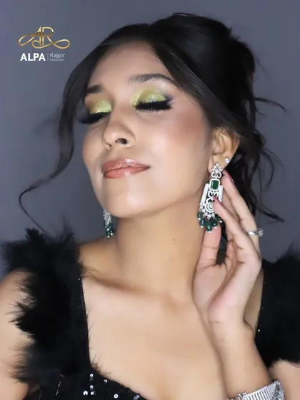 Eyes closed to showcase the detailed eyeshadow blending and liner.