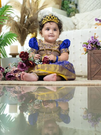 A beautiful, calm portrait with a stunning reflection. This image showcases the rich texture of the silk dress and the intricate details of the setup.
