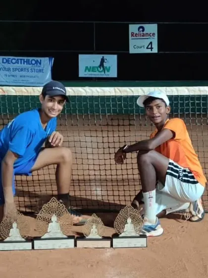Tavish Pahwa and his doubles partner Hruthik Katakam after the finals of the Asian Under 14 tournament in Ahmedabad, showcasing their trophies.