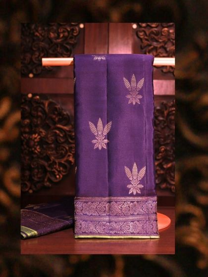 A royal blue Kanjivaram with a vibrant green border and blouse, a regal choice for any grand occasion.