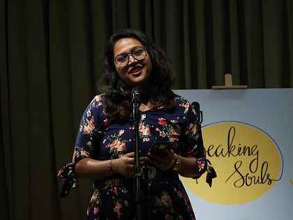 A happy performer from "Speaking Souls" sharing her poetry.