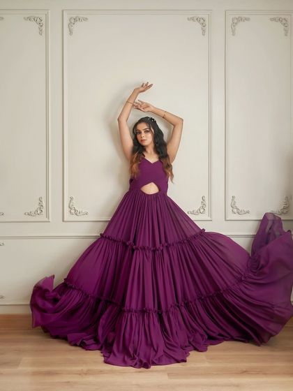 The 'Mindy' gown in all its glory. The flowing, layered skirt creates a stunning effect, perfect for a dramatic, high-fashion pre-wedding or maternity shoot.