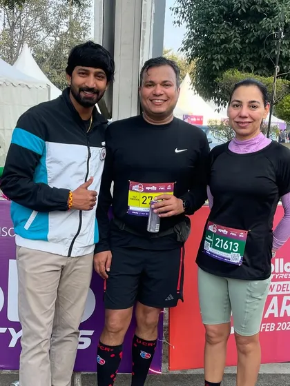 Posing with runners at the Apollo Tyres Marathon. These events are a celebration of the running community's spirit.