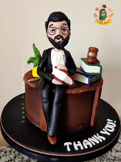 A sweet "Thank You" for a dedicated lawyer. This cake features a custom figurine of the lawyer at his desk, complete with edible law books and a gavel. It’s a unique and thoughtful way to show appreciation for his hard work.