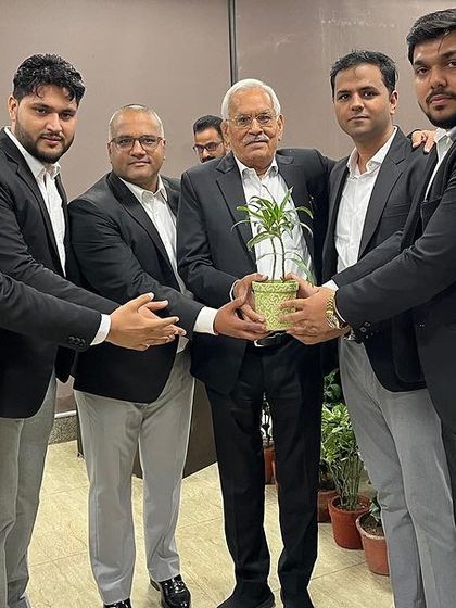 Presenting a plant to a senior guest at the app launch event. We are grateful for the support and guidance from senior members of the fraternity.