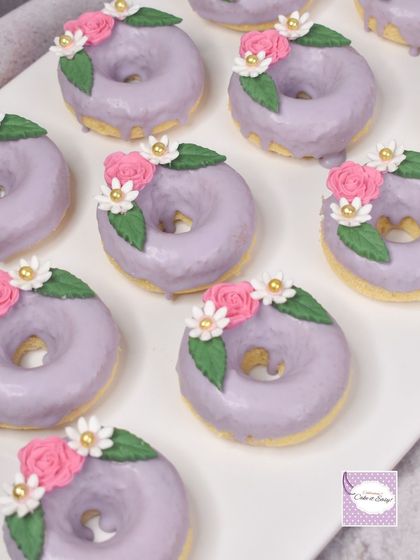 Baked donuts with a lavender glaze and delicate handmade sugar flowers for our fairy garden theme. These are baked, not fried, for a lighter, cake-like texture.