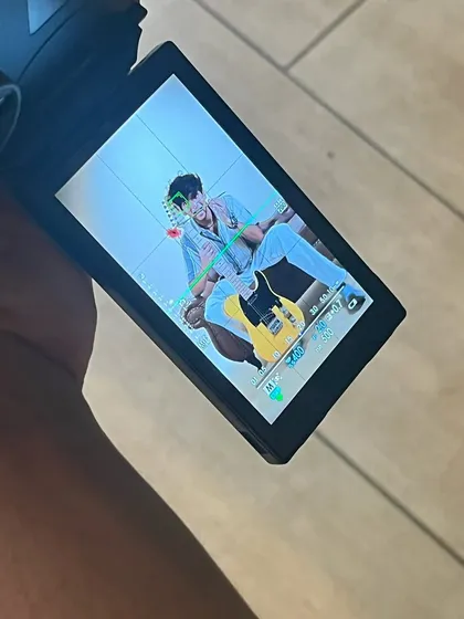 A look through the camera's viewfinder during the musician's photoshoot, offering a glimpse into the creative process.