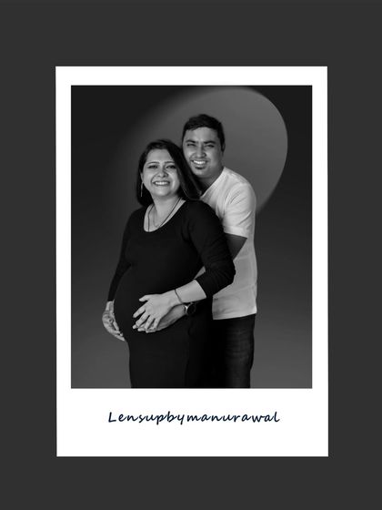 A happy, classic couple's portrait presented in a fun polaroid style. This black and white shot captures the pure joy and excitement of the parents-to-be in a timeless format.