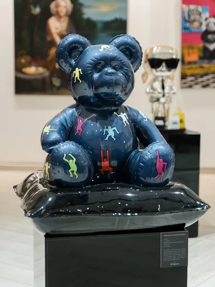 We commissioned 'Ted – Ode To Keith Haring' to turn a familiar form into a symbol of innocence with an edge. Its chrome surface mirrors the world, while Keith Haring’s iconic figures flow across the form, standing for joy, freedom, and raw, unfiltered energy.