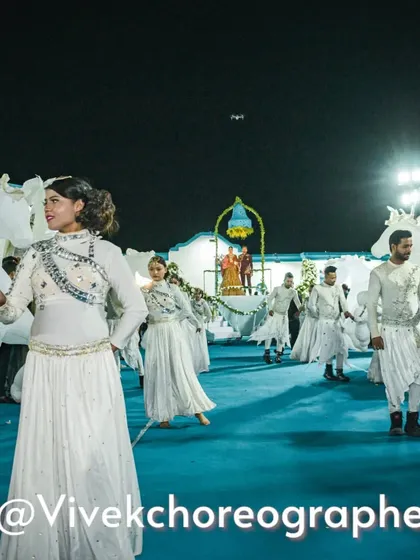 A whimsical varmala entry with dancers carrying horse-shaped props. This creative concept adds a fairytale element to the procession, leading to the main stage.