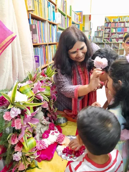 A beautiful, tender moment during our Ganesh Chaturthi celebration, where we begin with blessings. These small rituals help connect the children to the cultural significance of the festival.