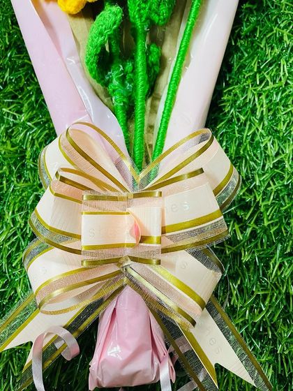 The final touch on my bouquets is a beautiful, high-quality bow that complements the colors of the flowers and the wrapping paper.