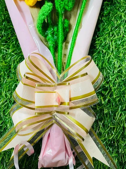 The final touch on my bouquets is a beautiful, high-quality bow that complements the colors of the flowers and the wrapping paper.