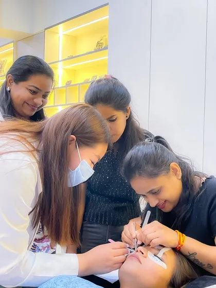 Our small batches mean you get the personal attention you deserve. Here, our instructor guides students through the delicate process of lash application on a live model, ensuring every detail is perfect.