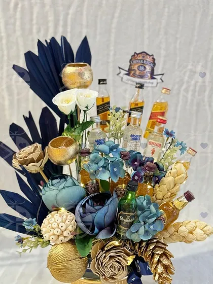 Rakhi gifts like this are sure to bring a smile to your sibling's face. This alcohol bouquet is a fun and luxurious option for a modern Rakhi celebration.