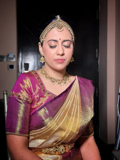 A serene portrait of the Iyengar bride, her soft glam makeup and classic Kanjivaram saree creating a look of timeless grace.