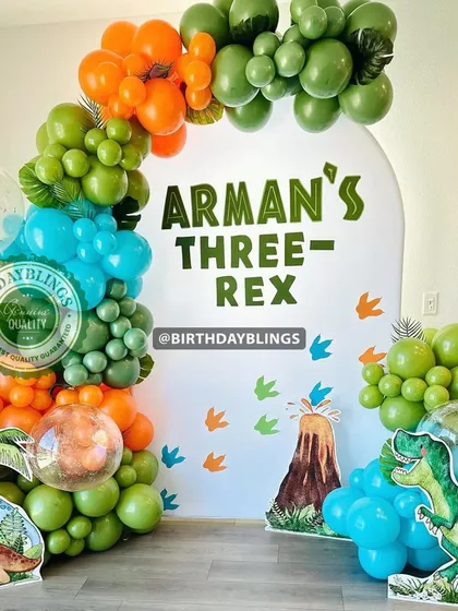 A straight-on shot of the dinosaur party, ready for the birthday boy.