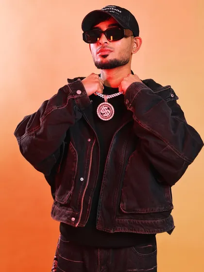 Confidence powered by music. This is the look of an artist who is serious about his craft. I bring this same focus and energy when I'm producing for other artists, helping you find your confidence on the mic and in your sound.