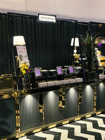 A wide view of our sophisticated Teppanyaki station, elegantly integrated into the event's decor. We bring a touch of luxury and perfection to every gathering, ensuring every detail is flawlessly curated.