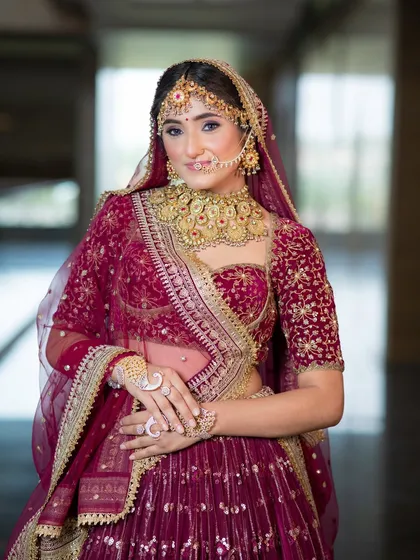A half-length portrait of this royal bride. The soft blush and structured brows frame her face beautifully, while the makeup remains elegant and not overpowering, even with the heavy jewellery.