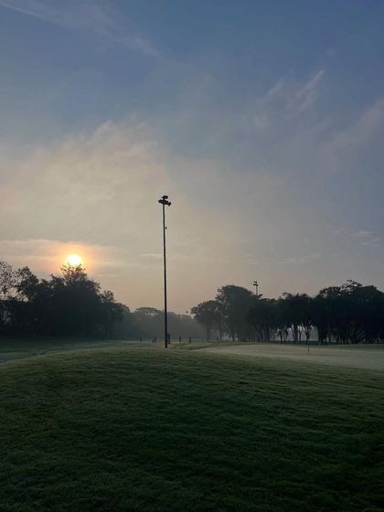 An early morning start, with mist covering the greens. This is a magical time to play, requiring focus and a deep appreciation for the quiet moments in golf.