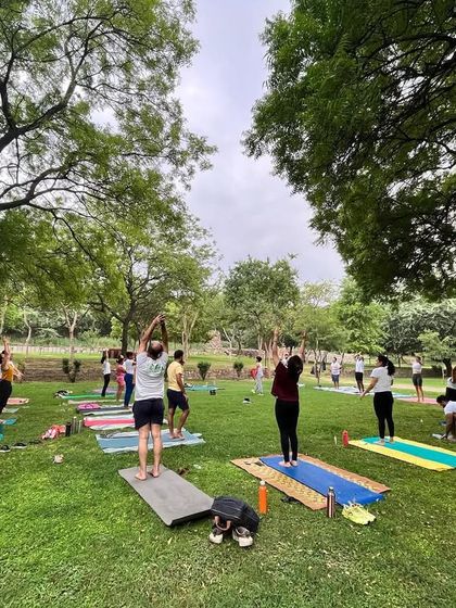 A wide shot of our outdoor yoga class, with students of all ages and levels practicing together.