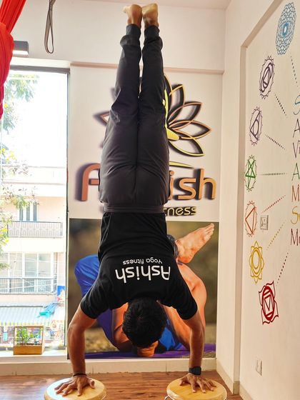 A handstand performed on balancing blocks, taking the challenge of inversion to the next level.