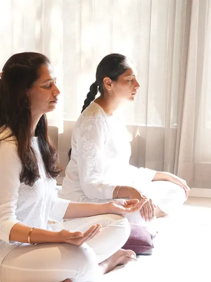 Two students in a state of meditative calm. You can sense the transformative energy we cultivate in our workshops.