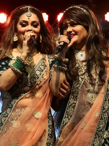 A close-up of us singing together, sharing a microphone. This shows our closeness and the seamless way we perform as a duo.