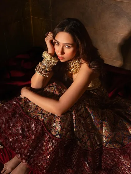 A contemplative pose from Pashmina Roshan, showcasing our oxidized silver kadas, a perfect blend of heritage and contemporary style.