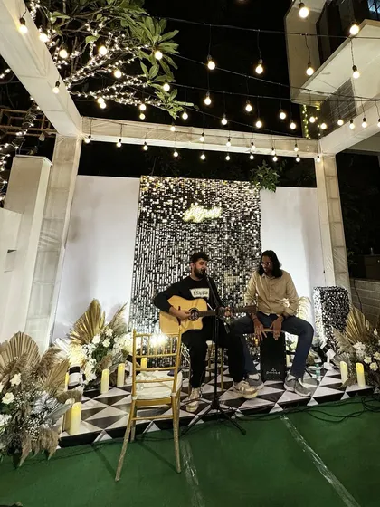 We set the stage for an unforgettable cocktail party under the stars. A shimmering sequin backdrop, elegant pampas grass arrangements, and the soulful sounds of a live acoustic set created an atmosphere of pure glamour and intimacy.