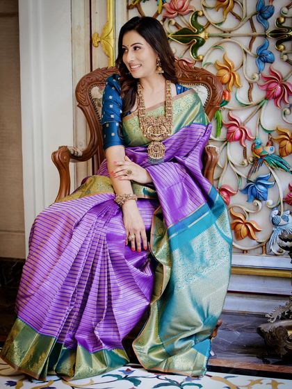 Dr. Shruthi embraces heritage and exudes grace in this purple and green striped Kanchipuram silk saree.