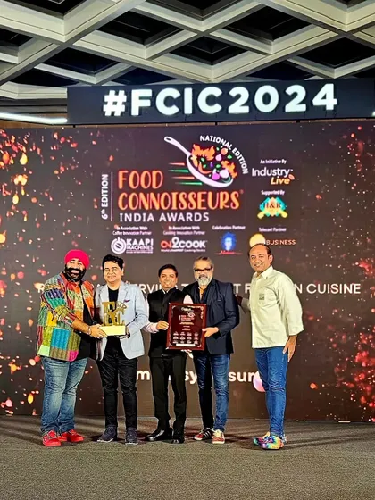 Another shot of our team receiving an award on stage.