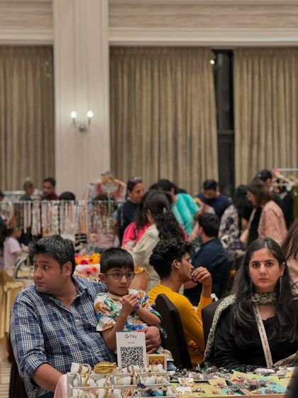 Even with seating areas, the aisles remain busy. This image captures the density of the crowd and the engaged atmosphere of the event.