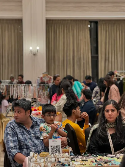 Even with seating areas, the aisles remain busy. This image captures the density of the crowd and the engaged atmosphere of the event.