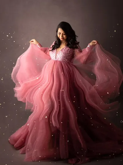 I love adding a little bit of magic to my photos. This fine-art portrait features a mom-to-be in a stunning pink gown, with a sprinkle of fairy dust effect to highlight her radiant pregnancy glow.