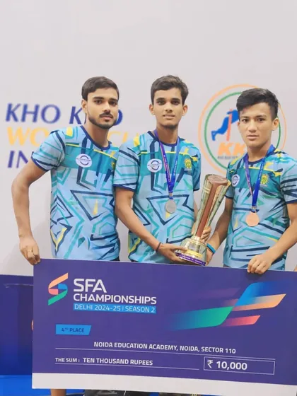 Our athletes from the Noida Education Academy holding the winner's trophy and prize money at the SFA Championships Delhi.
