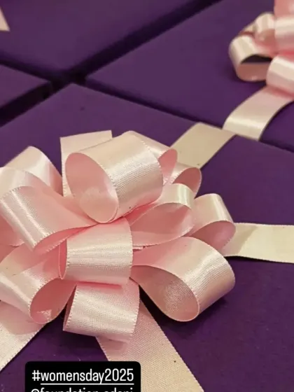 A close-up of the beautiful pink bows on the Women's Day gifts for the Adani Foundation. Even in bulk orders, I ensure that the finishing touches are perfect and add a touch of celebration.